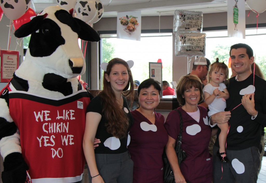 Dr. Melonakos celebrated Cow Appreciation Day with his daughter and staff.