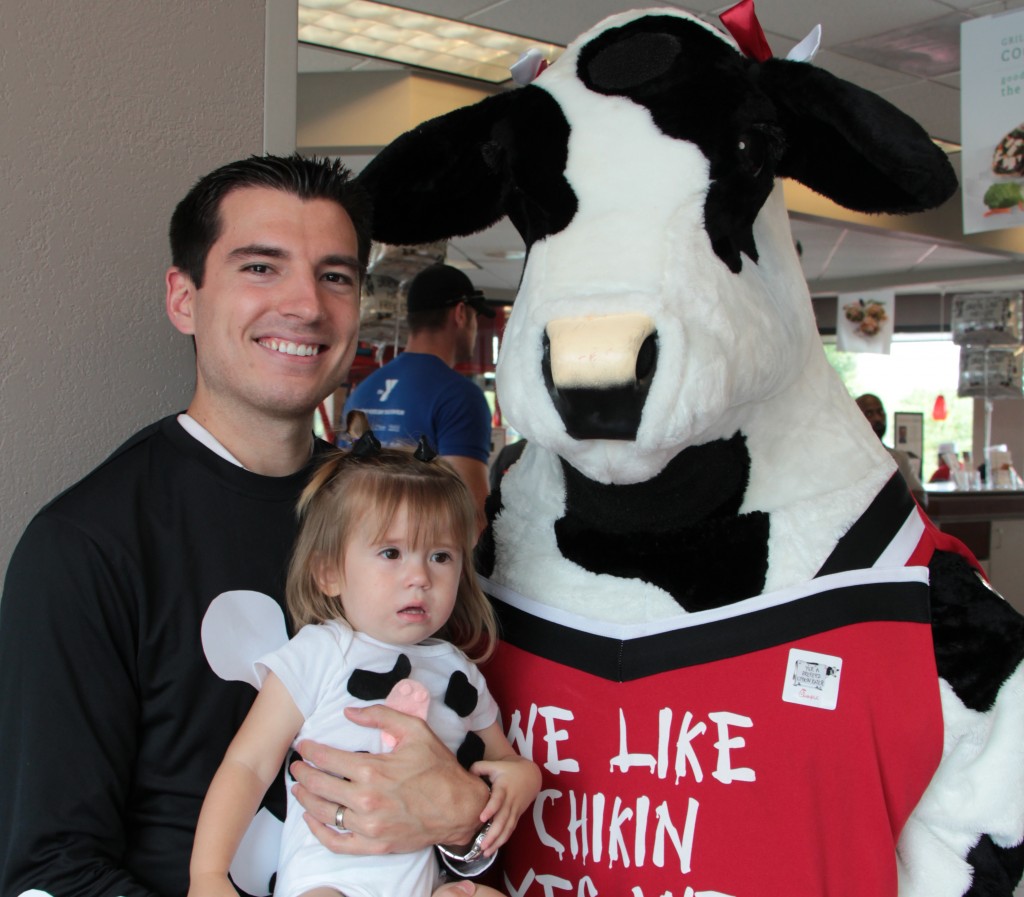 Dr. Melonakos and daughter appreciating cows.