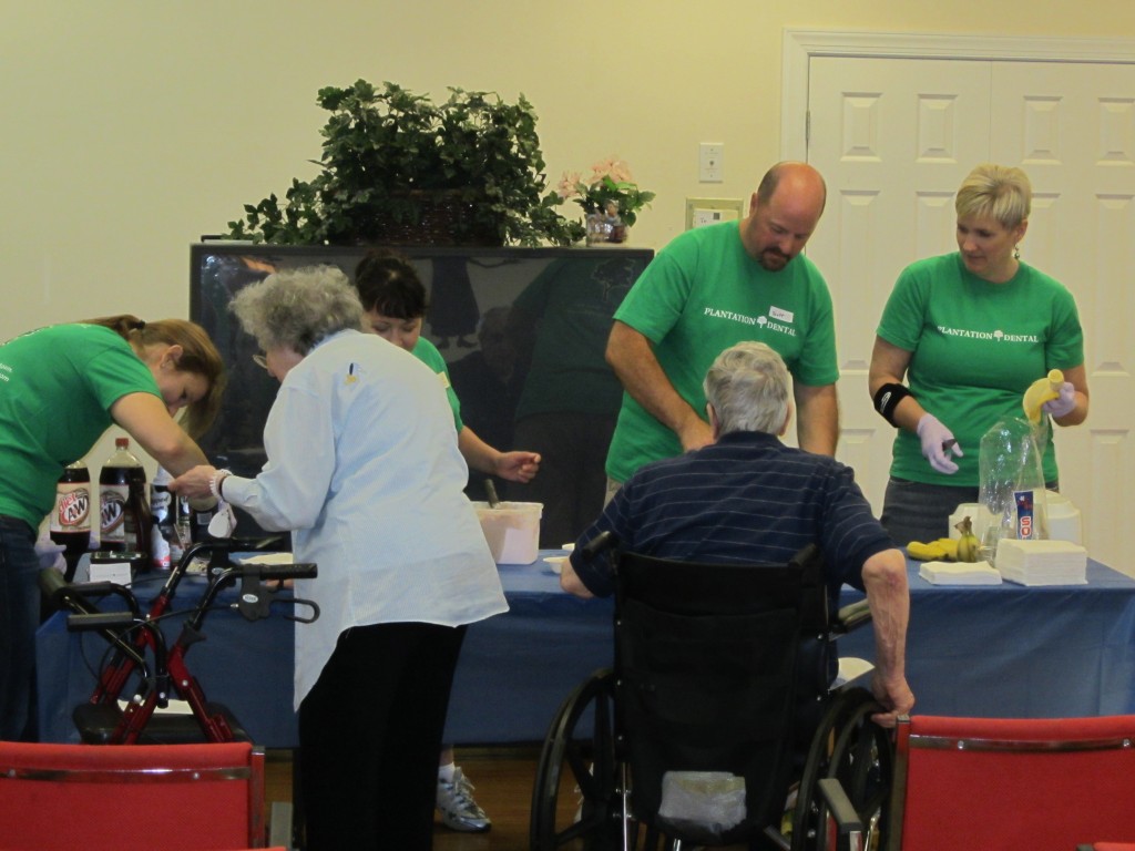 Staff volunteered to serve residents ice cream at the 2nd annual "Sundaes on Saturday" event.