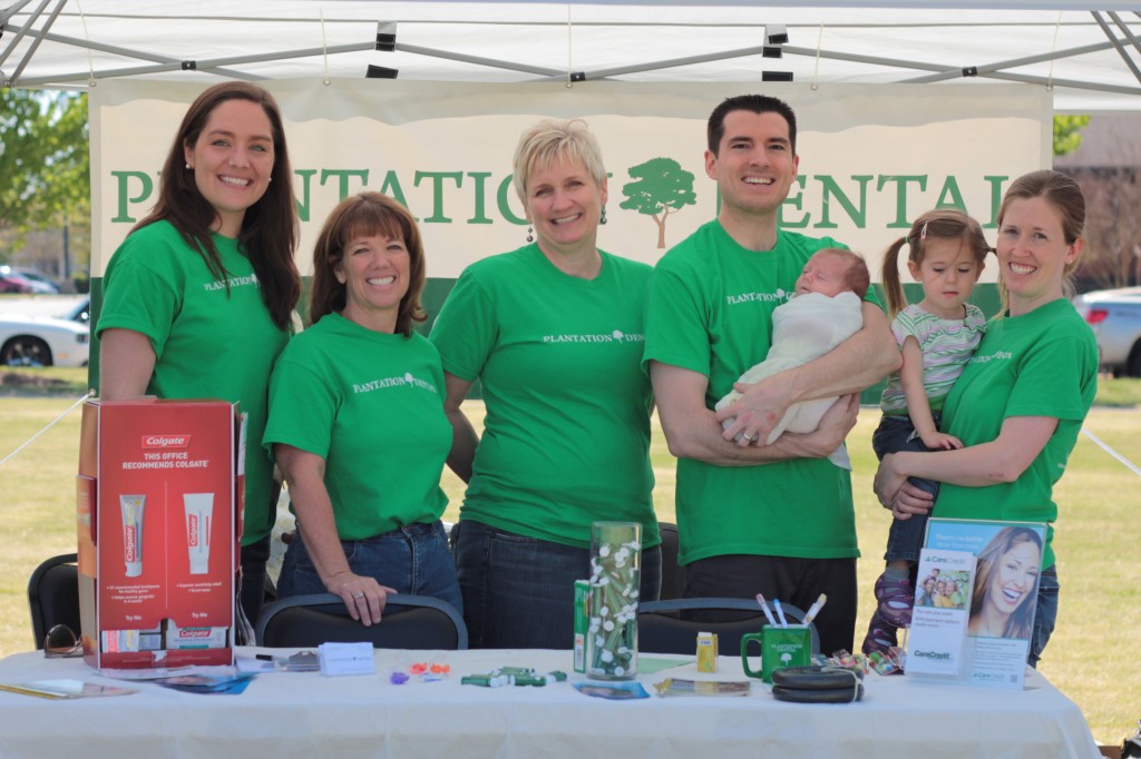 Dr. Melonakos, staff and family at the booth!